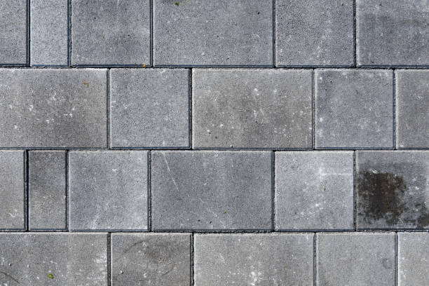 istock Concrete or cobble gray pavement slabs or stones  for floor, wall or path. 1041069890