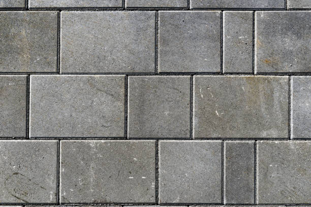 istock Concrete or cobble gray pavement slabs or stones  for floor, wall or path. 1041070478