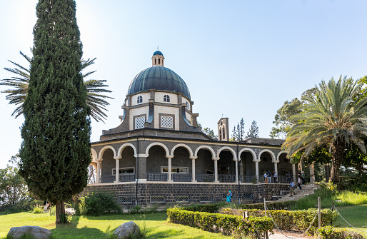 Tiberias, Israel, September 10, 2018 : Numerous tourists and believers consider the courtyard from the Beatitude Monastery located on the mountain on the coast of the Sea of Galilee - Kinneret