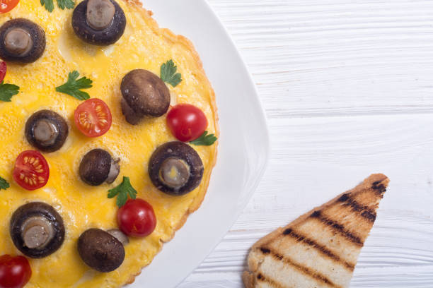 istock Omelette with mushroom , tomato and parsley 1041074802