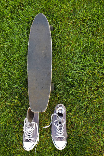 istock skate on the grass and sneakers 1041075270