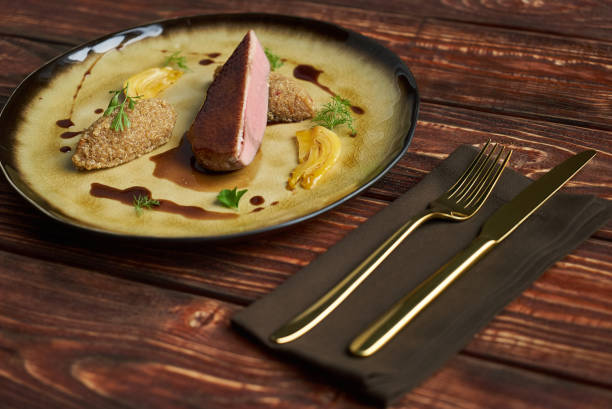 istock Cooked Quinoa with Duck breast meat. Orange fennel 1041076416