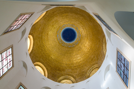 Tiberias, Israel, September 10, 2018 : The gilded dome on the ceiling in the central hall of the Beatitude Monastery located on the mountain on the coast of the Sea of Galilee - Kinneret