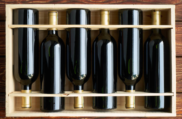 Wine bottles collection in wood box. Top view