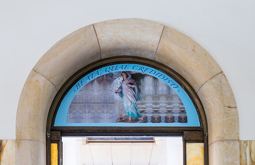 Tiberias, Israel, September 10, 2018 : Drawing on the wall with the plot of the walking virgin Mary above the exit from His Beatitude Monastery located on the mountain on the coast of the Sea of Galilee - Kinneret