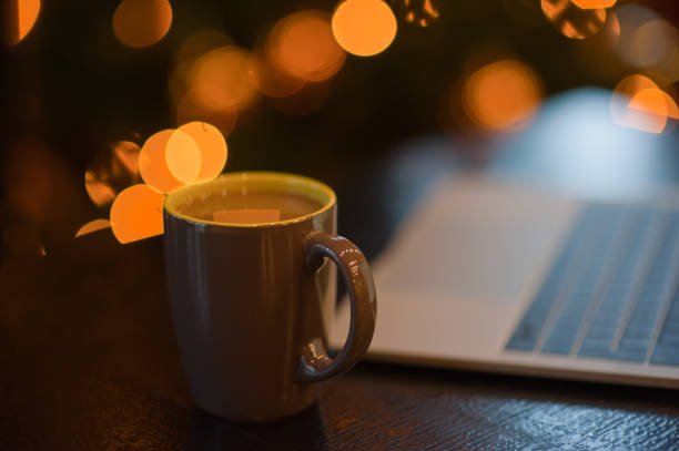 istock man working on a laptop in a cozy Christmas atmosphere 1041081820