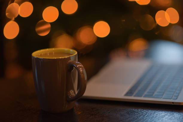 istock man working on a laptop in a cozy Christmas atmosphere 1041081828