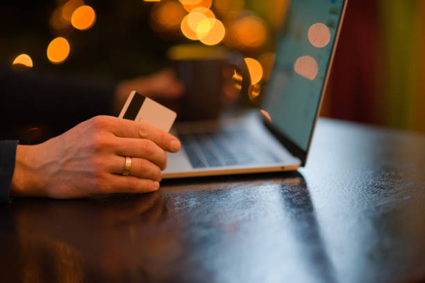 istock man working on a laptop in a cozy Christmas atmosphere 1041081872