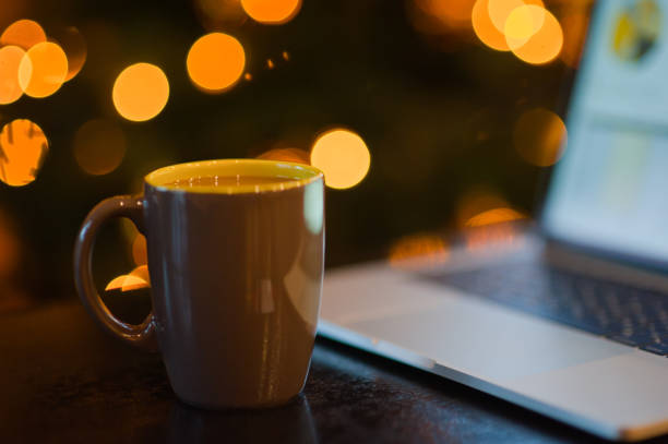 istock man working on a laptop in a cozy Christmas atmosphere 1041081874