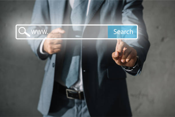 istock cropped view of developer in formal wear touching website search bar 1041084136