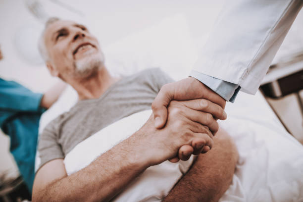 istock Patient Handshake with Doctor. Old Man in Clinik 1041084518