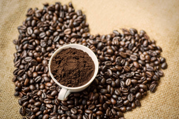 istock Ground coffee cup with coffee beans on table 1041088766