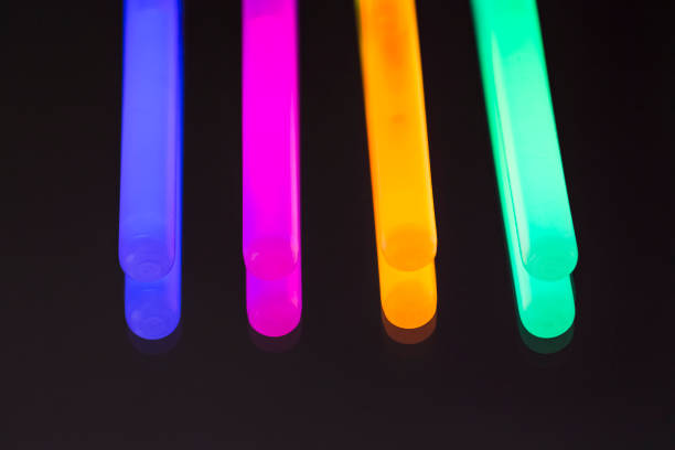 istock Colorful fluorescent light neon big glow stick on mirror reflection black background 1041090618