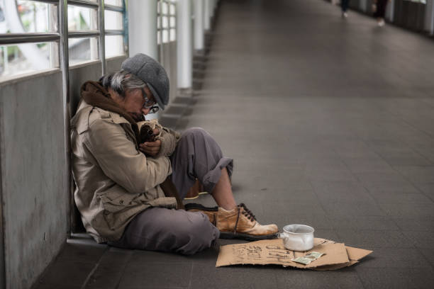 istock Homeless sleep and hold beer bottle 1041092214