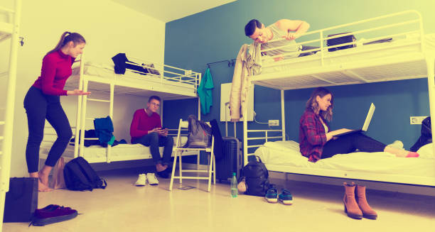 istock Travelers communicating in hostel bedroom 1041092244