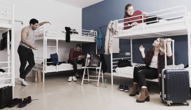 istock Travelers communicating in hostel bedroom 1041092250