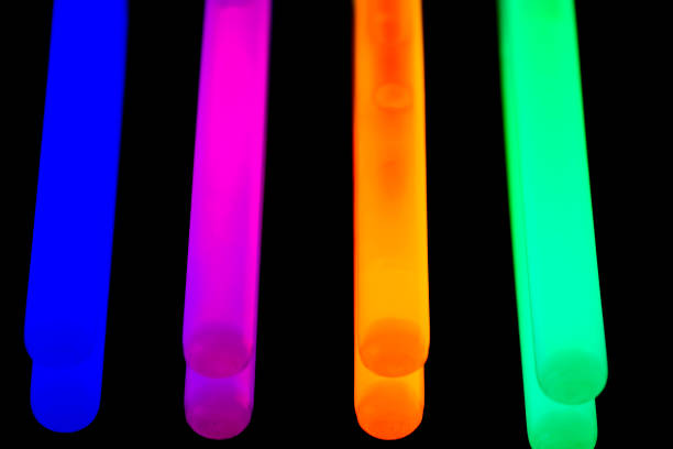 istock Colorful fluorescent light neon big glow stick on mirror reflection black background 1041092416