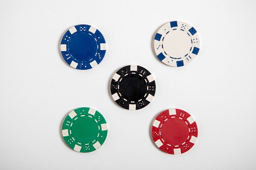 Poker coins, casino chips with white background and copy space..