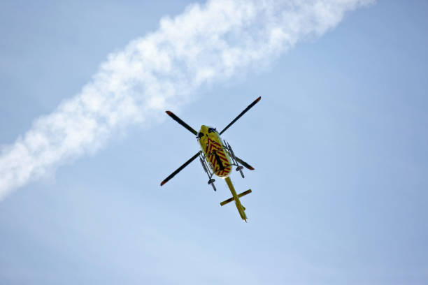 istock The helicopter flies in the sky 1041093648