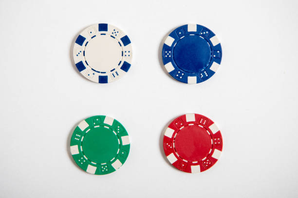 istock Four colored poker chips set. Without labels, isolated on white 1041095198