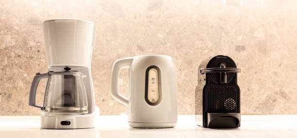 istock Kitchen small appliances on white surface. Colorful, blurred background. Close up view with details. 1041098014
