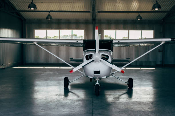istock modern small airplane standing in hangar 1041100890