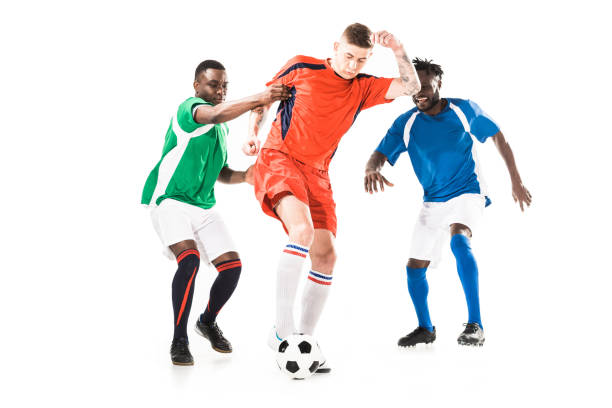 istock young multiethnic soccer players playing with ball isolated on white 1041103418