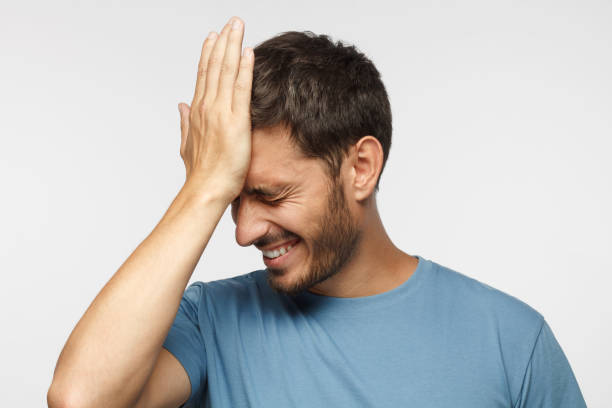 istock Face palm concept. Stressed out young guy making facepalm gesture with hand. 1041104050