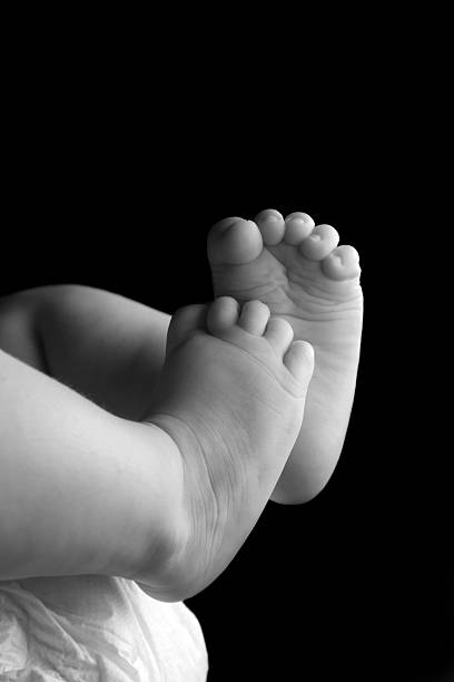 istock Baby girls feet 104110570