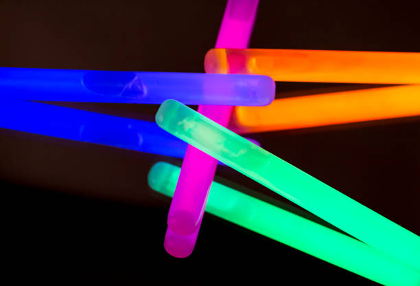 istock Colorful fluorescent light neon big glow stick on mirror reflection black background 1041109812