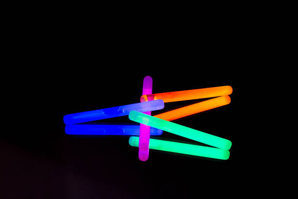 istock Colorful fluorescent light neon big glow stick on mirror reflection black background 1041111178