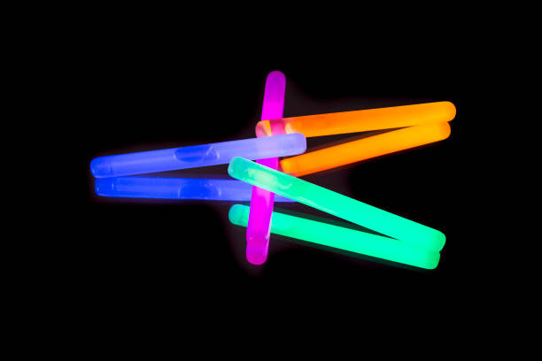 istock Colorful fluorescent light neon big glow stick on mirror reflection black background 1041113700