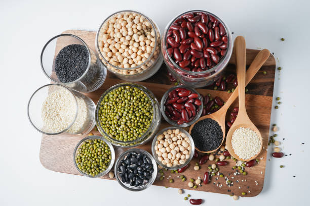 istock Many nuts and sesame seeds on wooden floor. 1041113846
