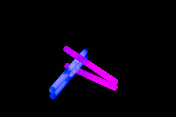 istock Colorful fluorescent light neon big glow stick on mirror reflection black background 1041114124