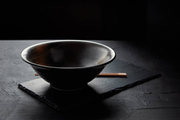 istock close-up view of empty bowl and chopsticks on black slate board 1041114880