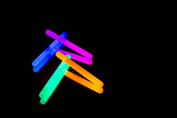 istock Colorful fluorescent light neon big glow stick on mirror reflection black background 1041114946
