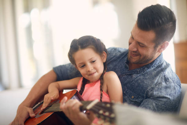 istock She wants to be just like dad! 1041115430