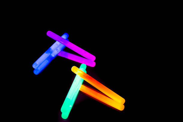 istock Colorful fluorescent light neon big glow stick on mirror reflection black background 1041116004