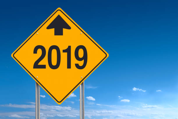 istock New Year Ahead 2019 Road Sign Over Blue Sky Background 1041116714