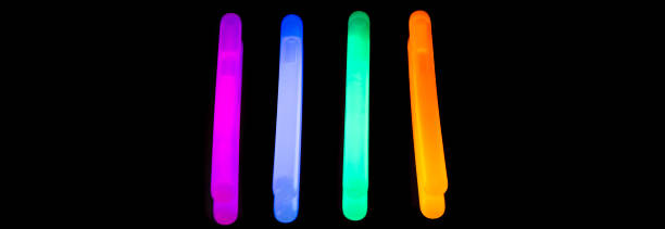 istock Colorful fluorescent light neon big glow stick on mirror reflection black background 1041117020