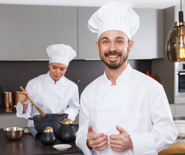 istock Male chef with female colleague 1041117236