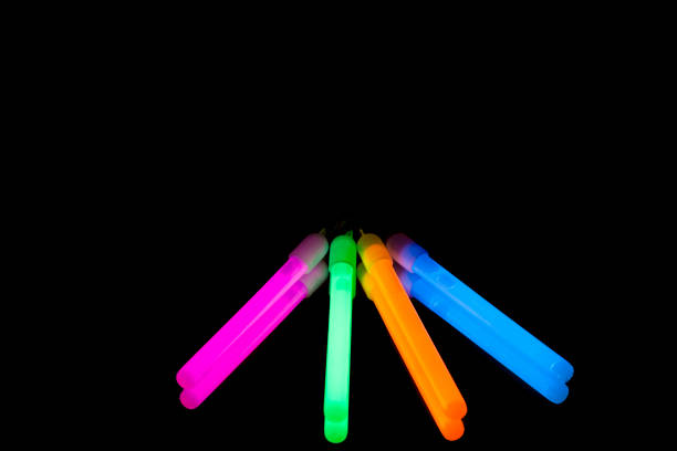 istock Colorful fluorescent light neon big glow stick on mirror reflection black background 1041118848