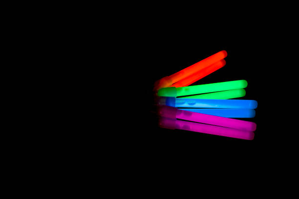 istock Colorful fluorescent light neon big glow stick on mirror reflection black background 1041123124
