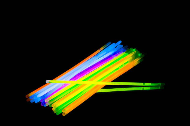 istock Colorful fluorescent light neon big glow stick on mirror reflection black background 1041124256
