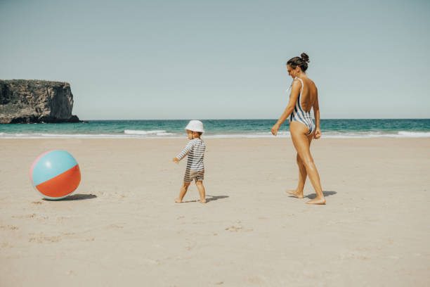 istock Mother and her son playing at the beach 1041125206