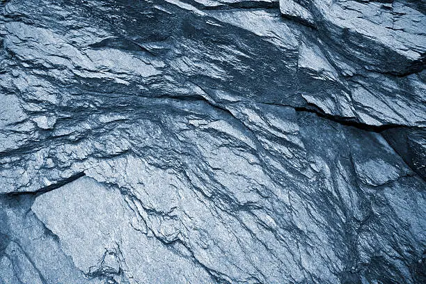 Photo of Schist dark gray metamorphic rock background