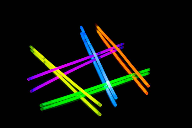 istock Colorful fluorescent light neon big glow stick on mirror reflection black background 1041130186