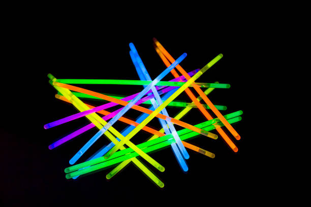 istock Colorful fluorescent light neon big glow stick on mirror reflection black background 1041132158