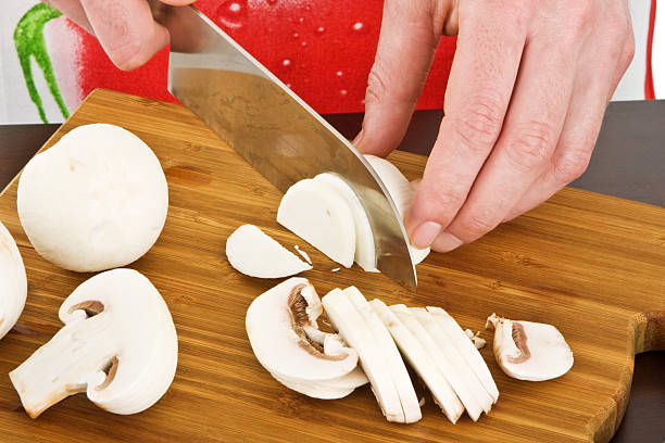 istock Male chef cutting mushrooms 104113362