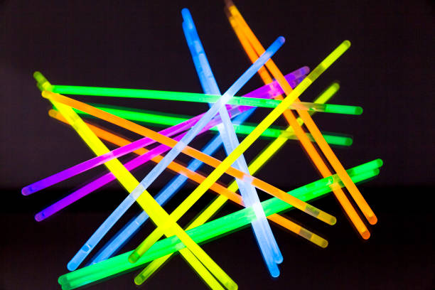 istock Colorful fluorescent light neon big glow stick on mirror reflection black background 1041137598